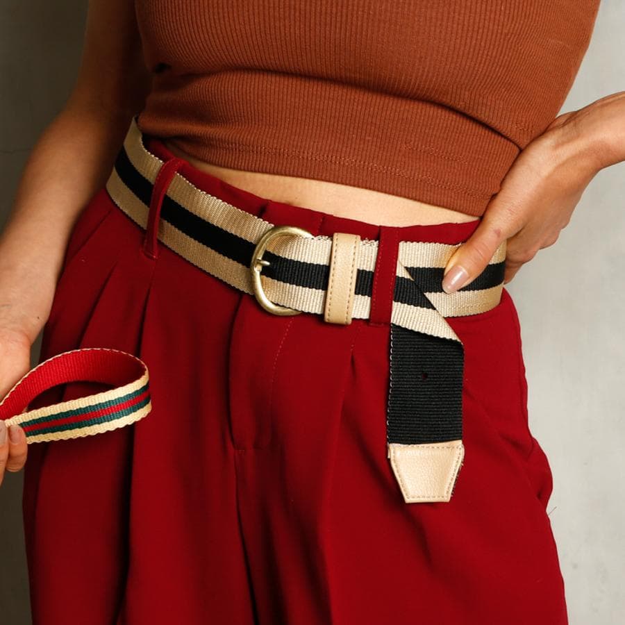 women's woven fabric striped belt with gold buckle and faux leather tip