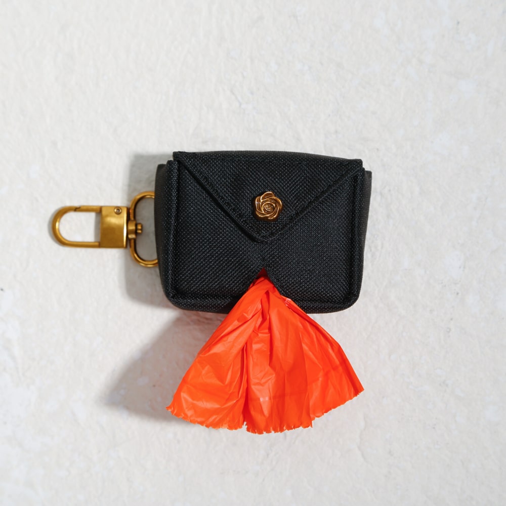 luxe poo bag holder with envelope flap